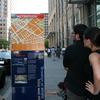 Out-of-towners take advantage of Downtown Brooklyn's kiosk signs.